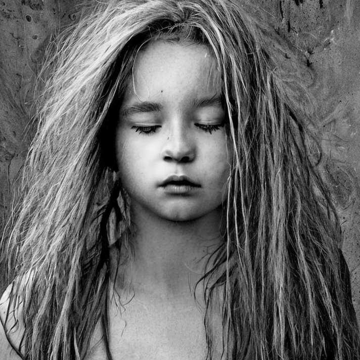 winter - a girl with messy hair turns inward